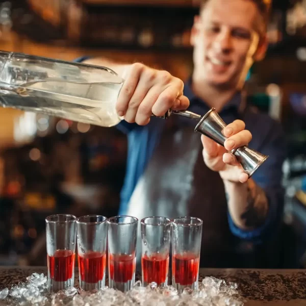 male-barman-in-apron-prepares-alcoholic-coctail.jpg